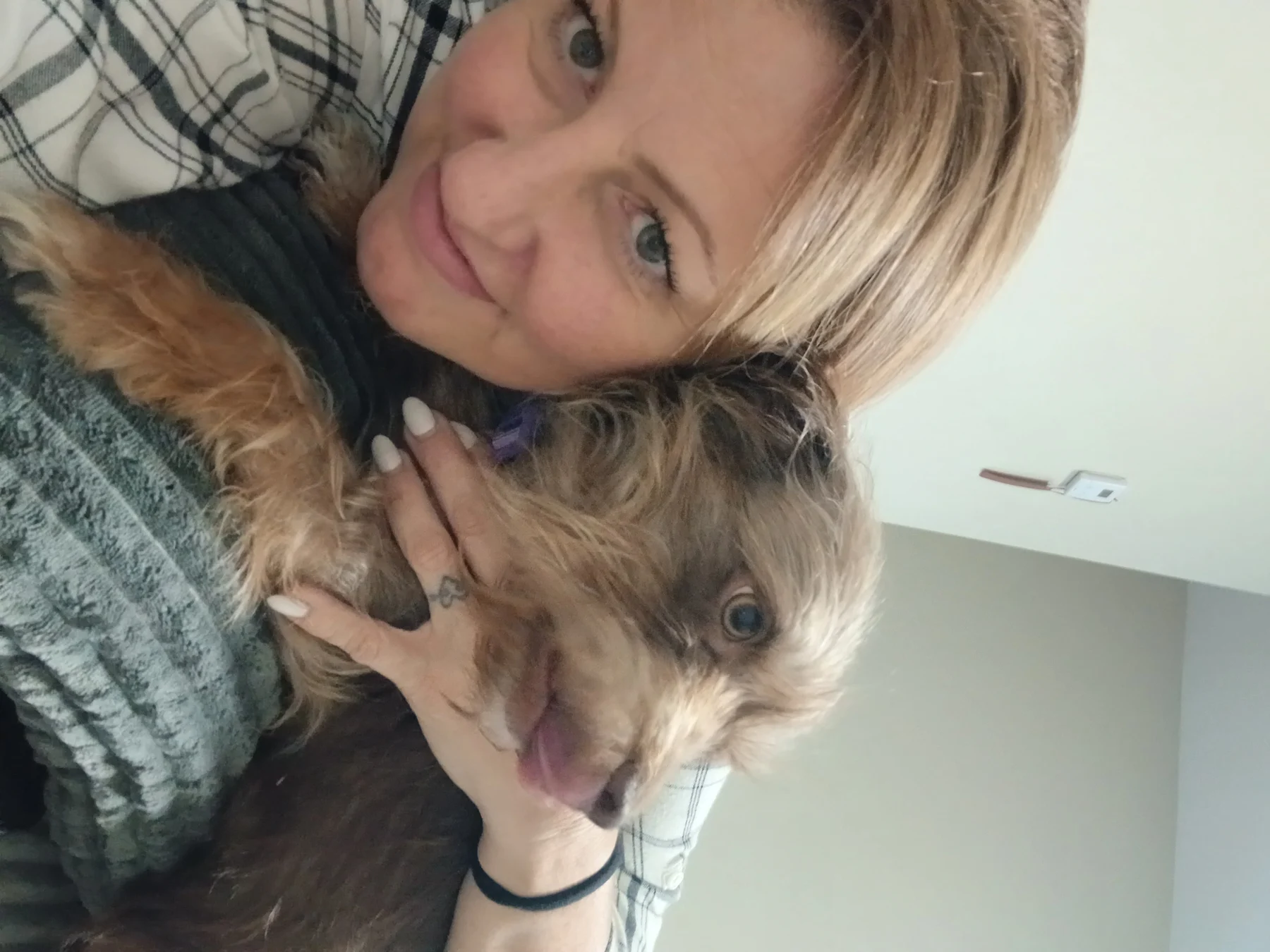 Amy cuddling with her dog Willa